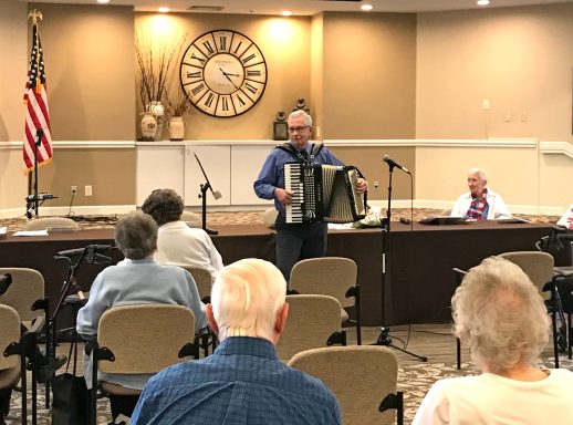 Tom playing accordion at the Corewell Seniors Commons.